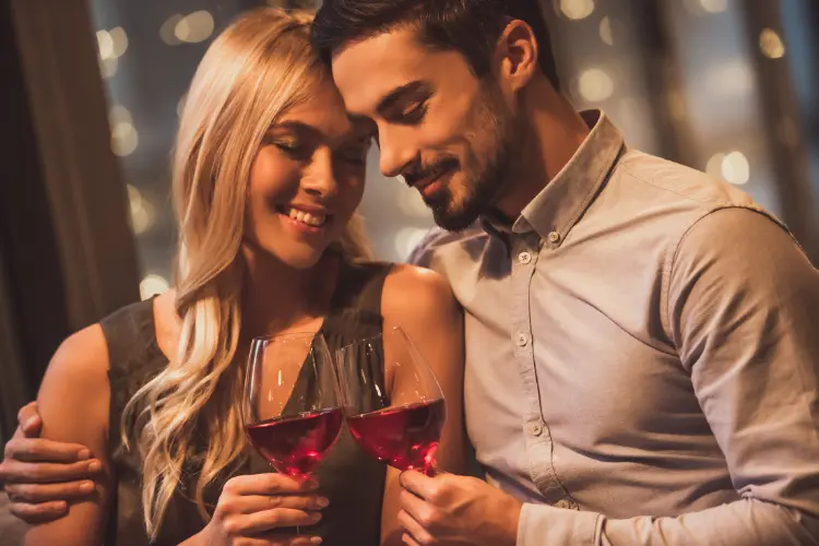 man and woman drinking a glass of wine in NeverFail Dating